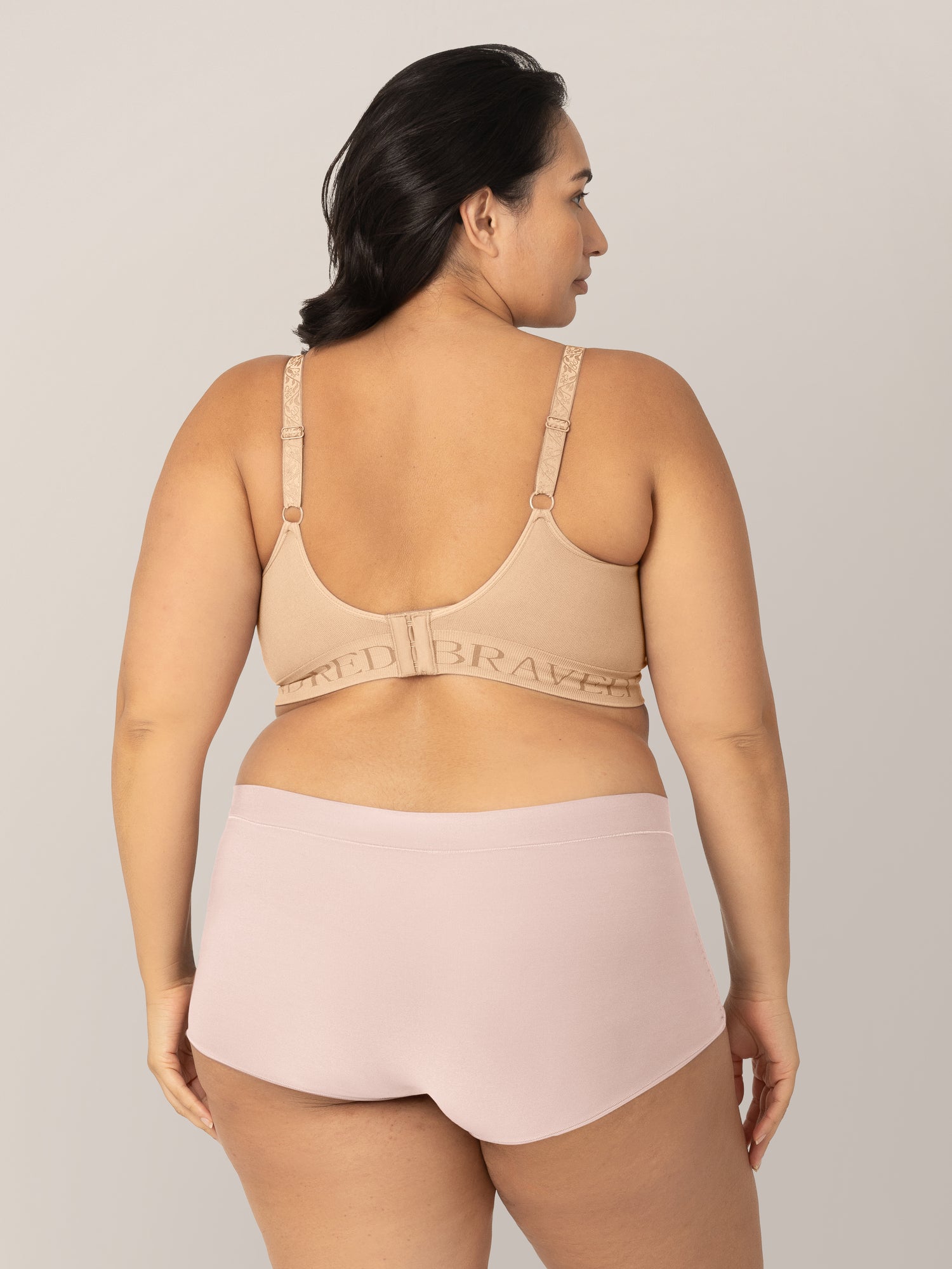 Back view of model wearing the Grow with Me Boyshort Underwear in Soft Pink.