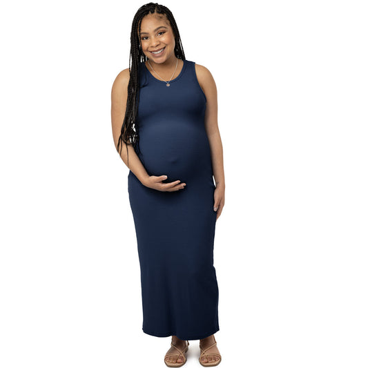 Model holding her baby bump while wearing the Gwen Ribbed Bamboo Maternity Midi Dress in Navy @model_info:Ruby is wearing a Medium.