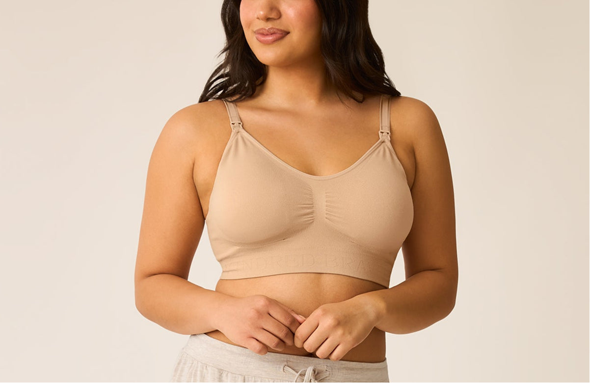 Front view of model wearing a nursing bra, on a neutral background