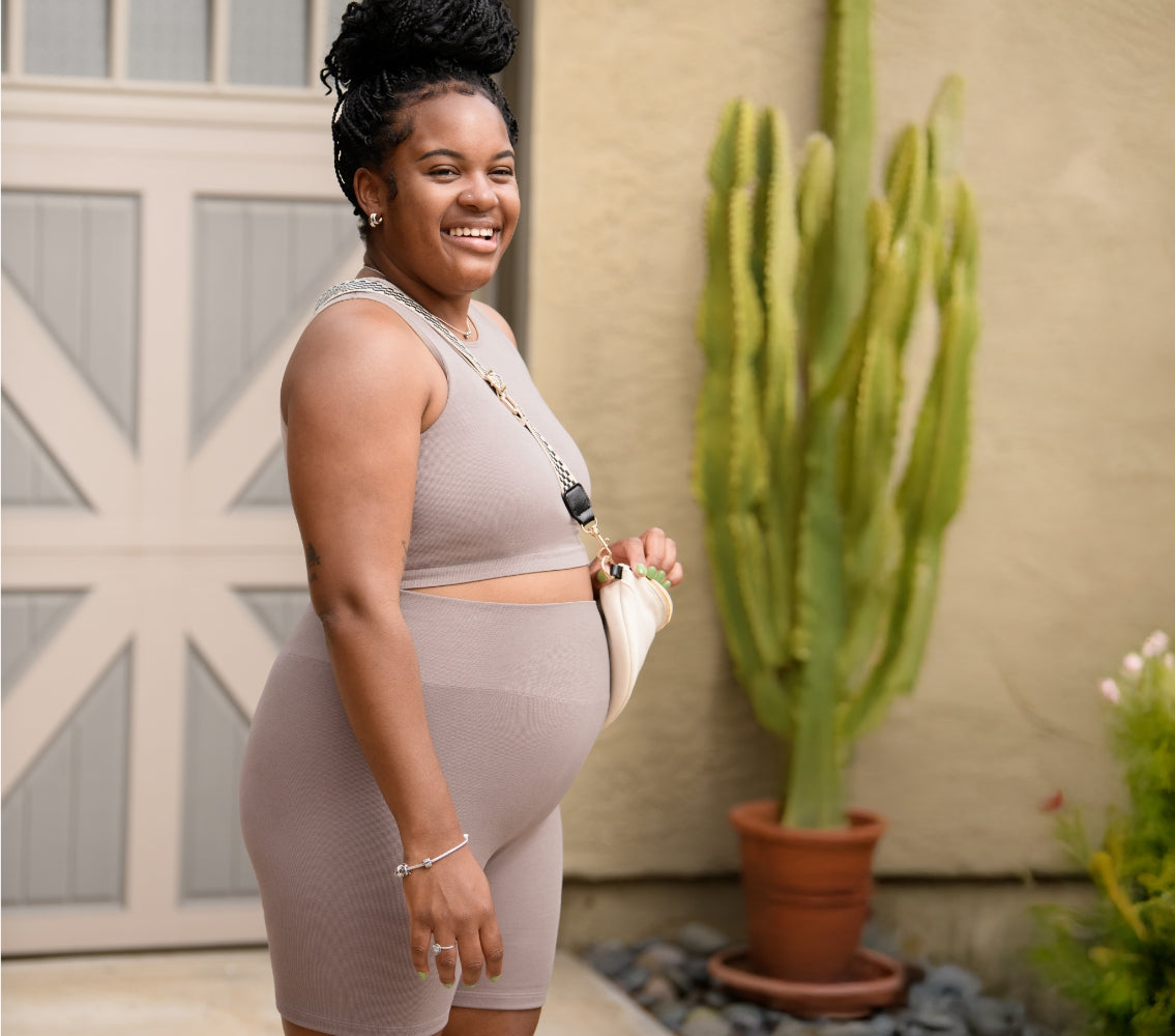 Model wearing the Sublime® Bamboo Maternity & Nursing Longline Bra Top and the Sublime® Bamboo Maternity & Postpartum Bike Short in Taupe.