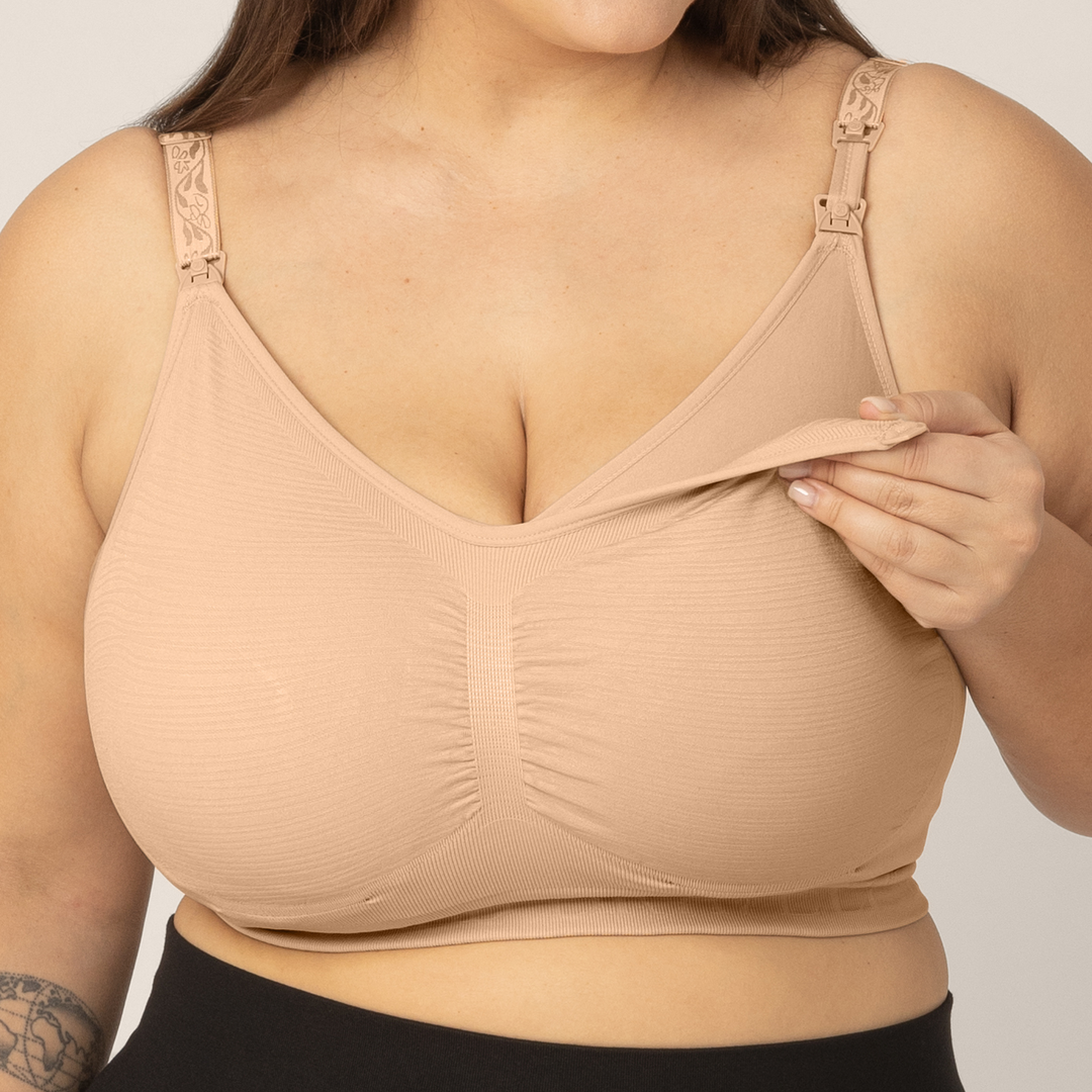 Zoomed in image of model wearing the Sublime Hands-Free Pumping & Nursing Bra in Beige, unclipped showing the pumping layer.