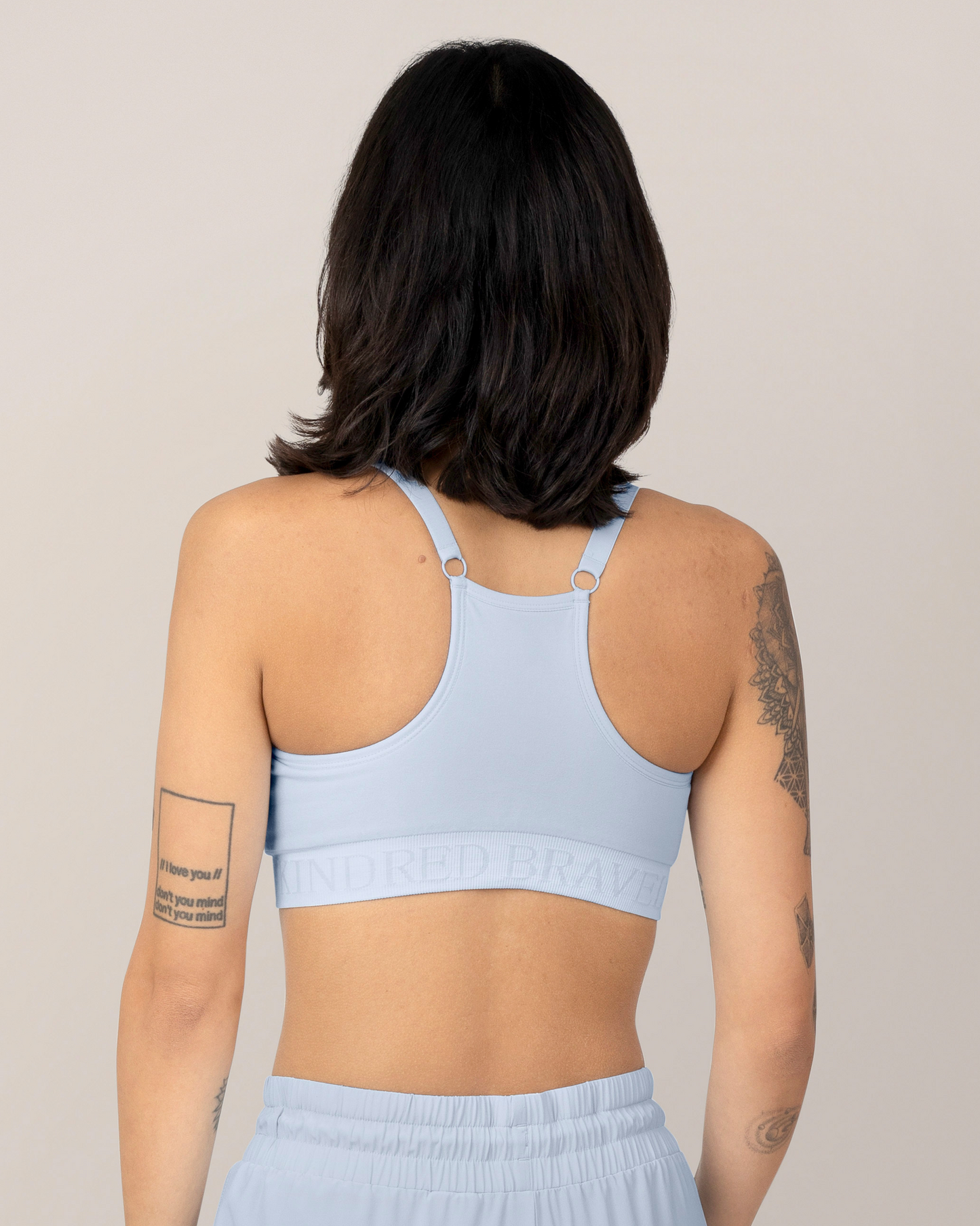 Back view of Model wearing the Sublime® Hands-Free Pumping & Nursing Sports Bra in French Blue