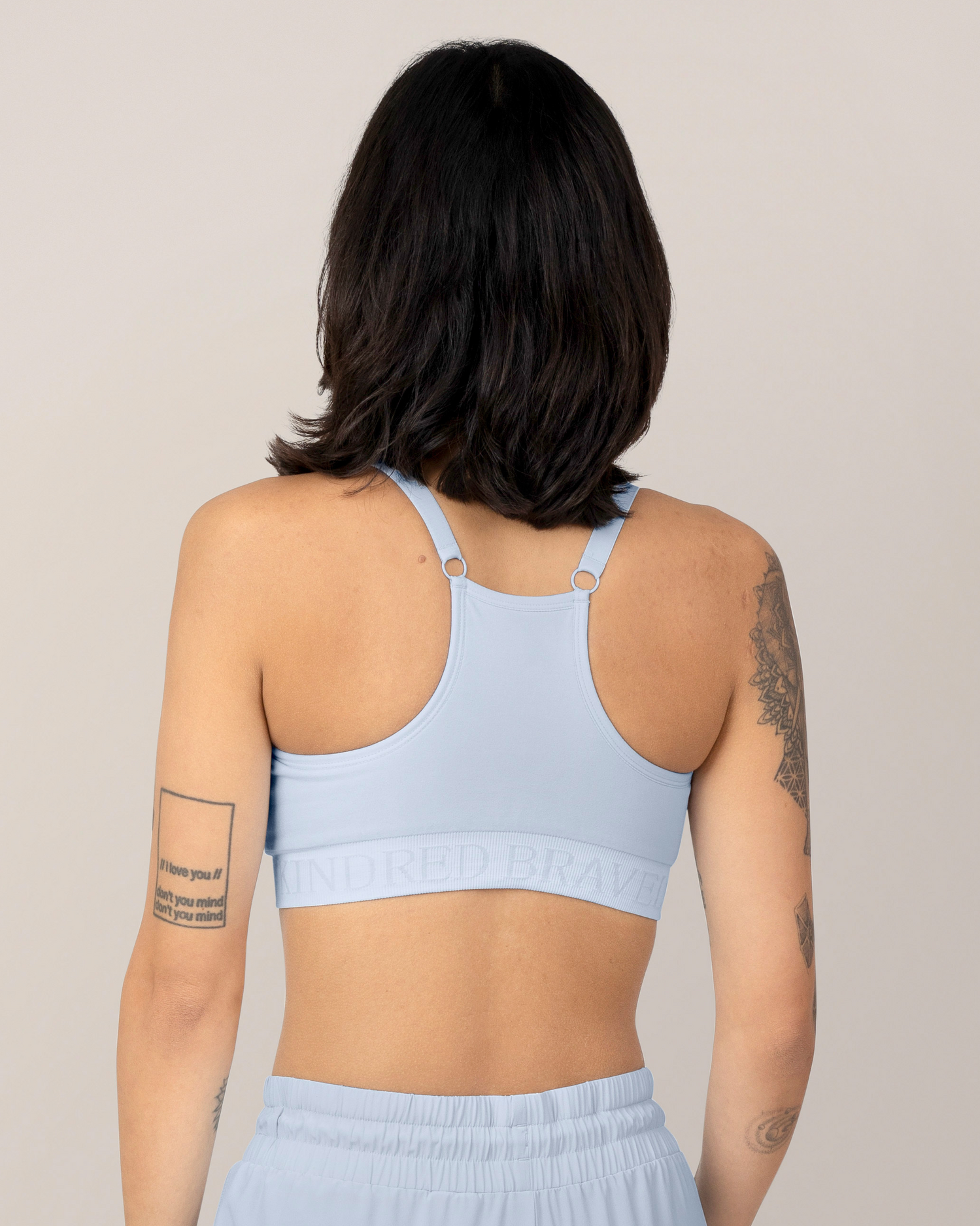 Back view of Model wearing the Sublime® Hands-Free Pumping & Nursing Sports Bra in French Blue