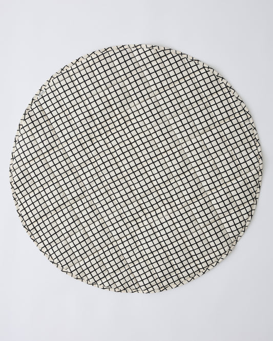 Inside/Outside Play Mat in Black Grid on a beige background.