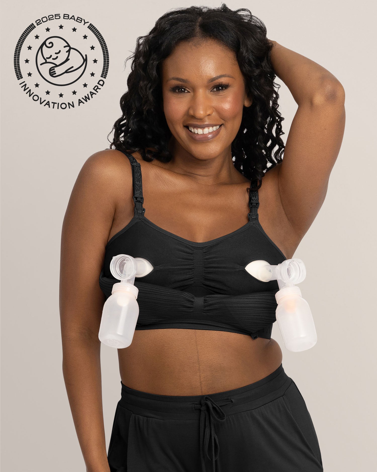 Model wearing the Sublime® Hands-Free Pumping & Nursing Bra in Black @model_info:Rashé is wearing a Large.
