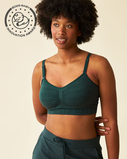 Front view of model wearing Sublime® Hands-Free Pumping & Nursing Bra in Evergreen @model_info:Kyra is wearing a Small.