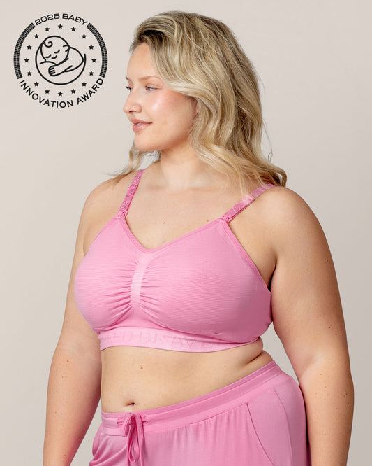 Side view of model wearing the Sublime® Hands-Free Pumping & Nursing Bra in Bubblegum with matching Everyday Lounge Joggers @model_info:Austen is wearing an X-Large Busty.