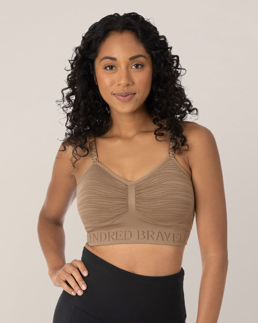 Model in the Sublime® Hands-Free Pumping & Nursing Bra in Latte, with one hand on her hip. @model_info:Anastacia is wearing a Small.