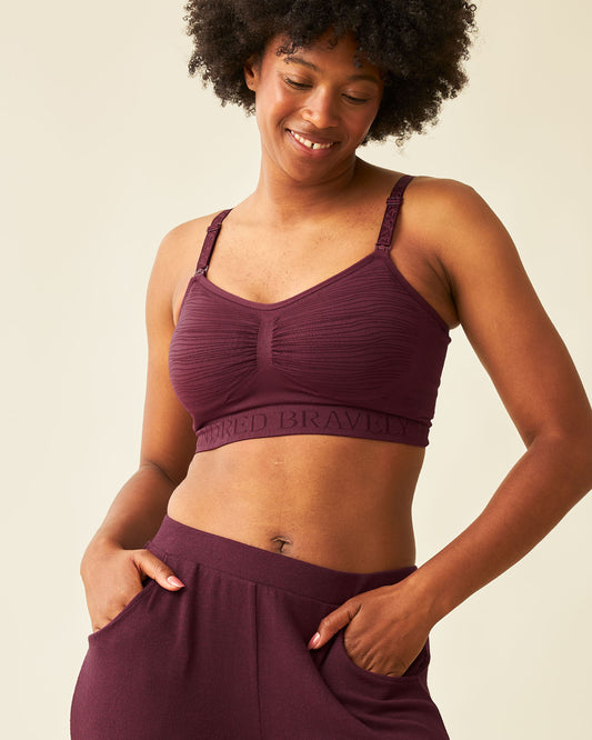Front view of model wearing Sublime® Hands-Free Pumping & Nursing Bra in Deep Burgundy @model_info:Kyra is wearing a Small.