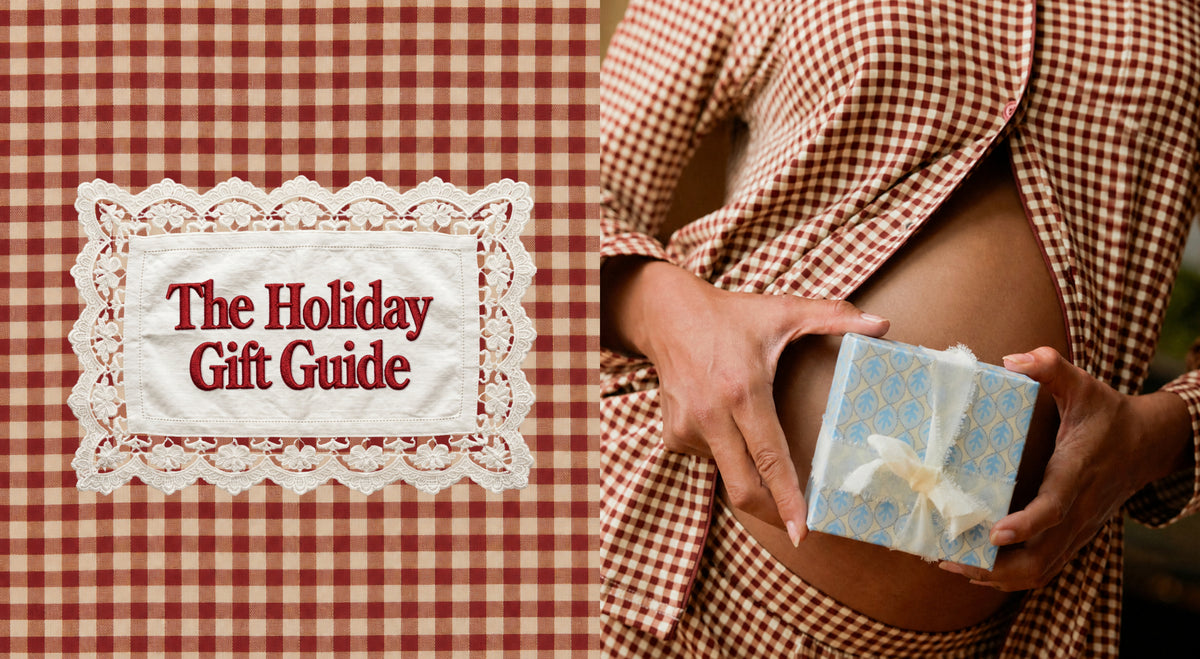 A split promotional graphic with a red-and-white gingham background. On the left is a white lace-bordered label reading 'The Holiday Gift Guide' in red serif text, other half is Model is wearing Clea Bamboo Long Sleeve Pajama Set in Auburn Gingham, holding a gift box.