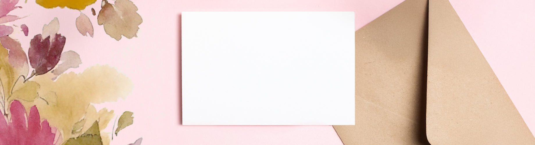 Pink and floral background with envelope and card