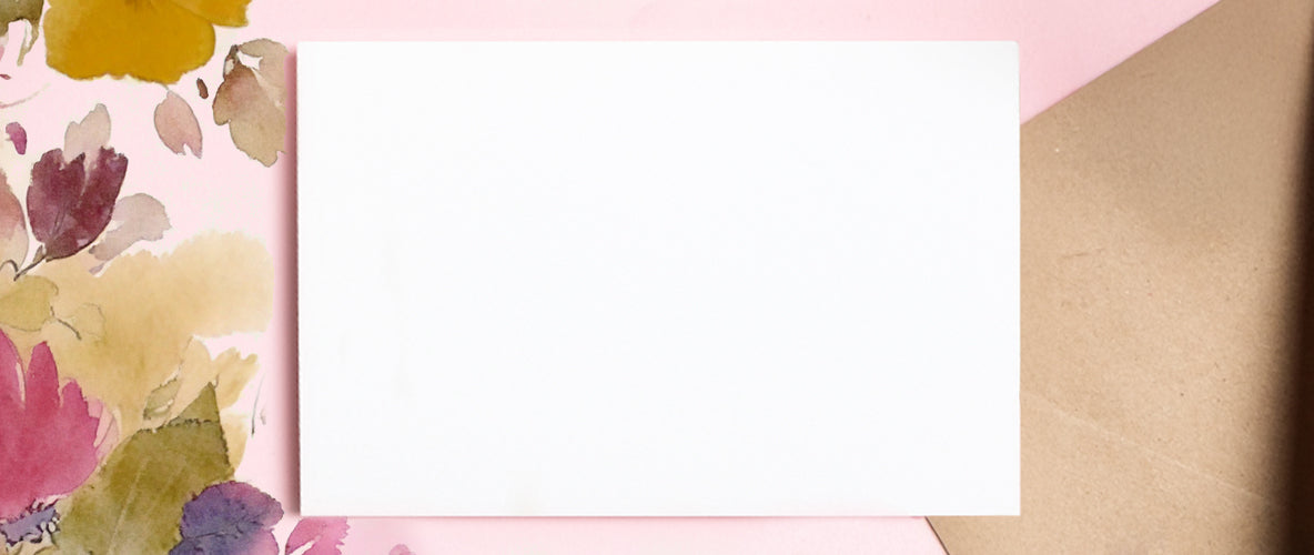 Pink and floral background with envelope and card