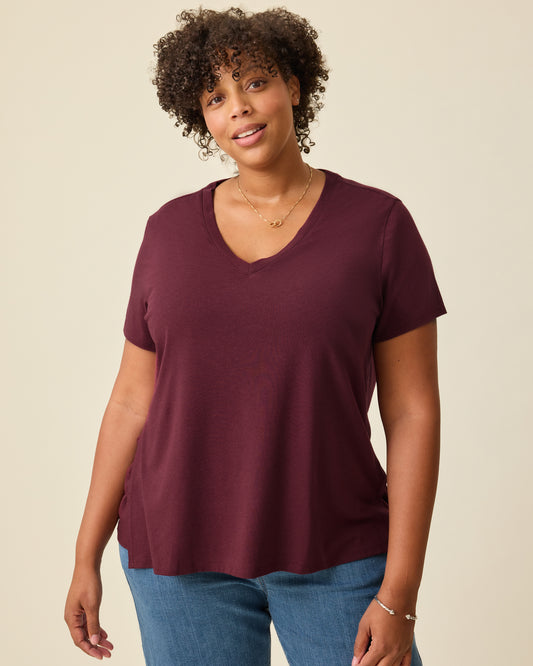 Model is wearing Modal V-neck Nursing T-shirt in Deep Burgundy on a beige background. @model_info:Skye is wearing an X-Large.
