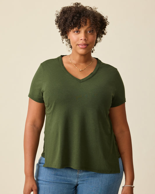 Model is wearing the Modal V-neck Nursing T-shirt in Deep Olive on a beige background. @model_info:Skye is wearing a Large.