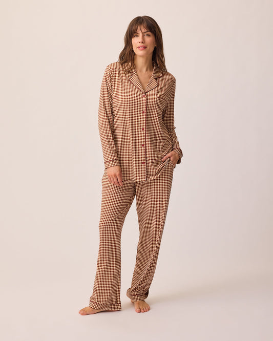 Model is wearing Clea Bamboo Long Sleeve Pajama Set in Auburn Gingham, on a beige background.@model_info:KJ is 5'9" and wearing a Medium.