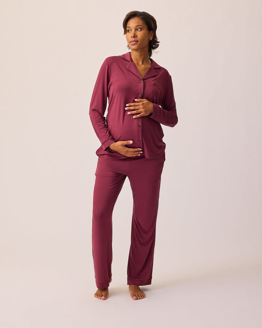 Model is wearing Clea Bamboo Long Sleeve Pajama Set in Deep Burgundy on a beige background.@model_info:Ale is 5'9" and wearing a Medium.