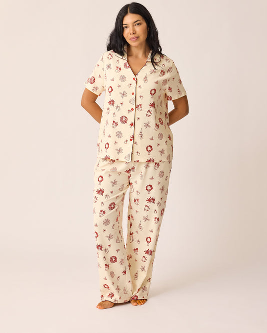 Model is wearing the Cotton Bamboo Pajama Set in Cozy Day pattern on a beige background. @model_info:Ashley is 5'7" and wearing a Medium.