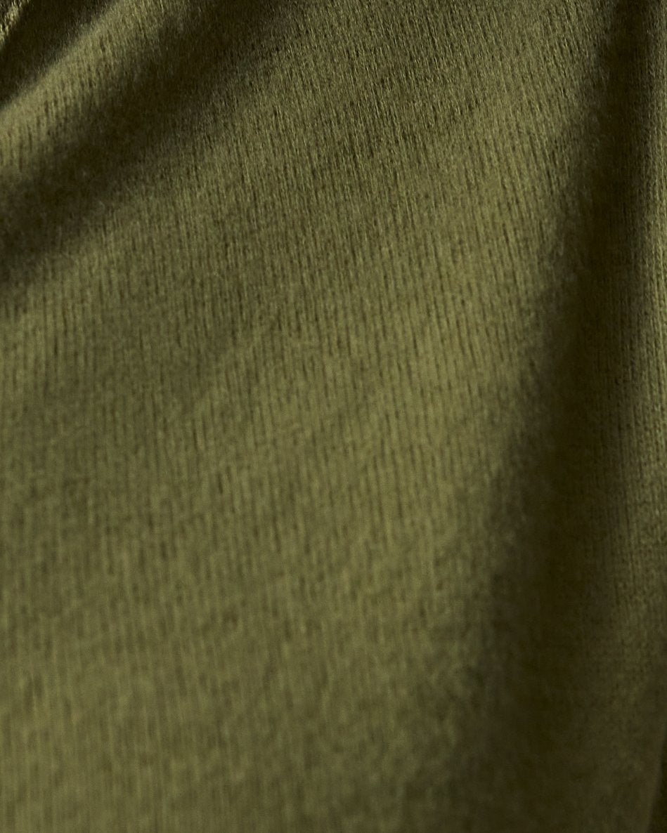 Close up of the texture of the CozyKnit Maternity & Nursing V-neck Top in Deep Olive.