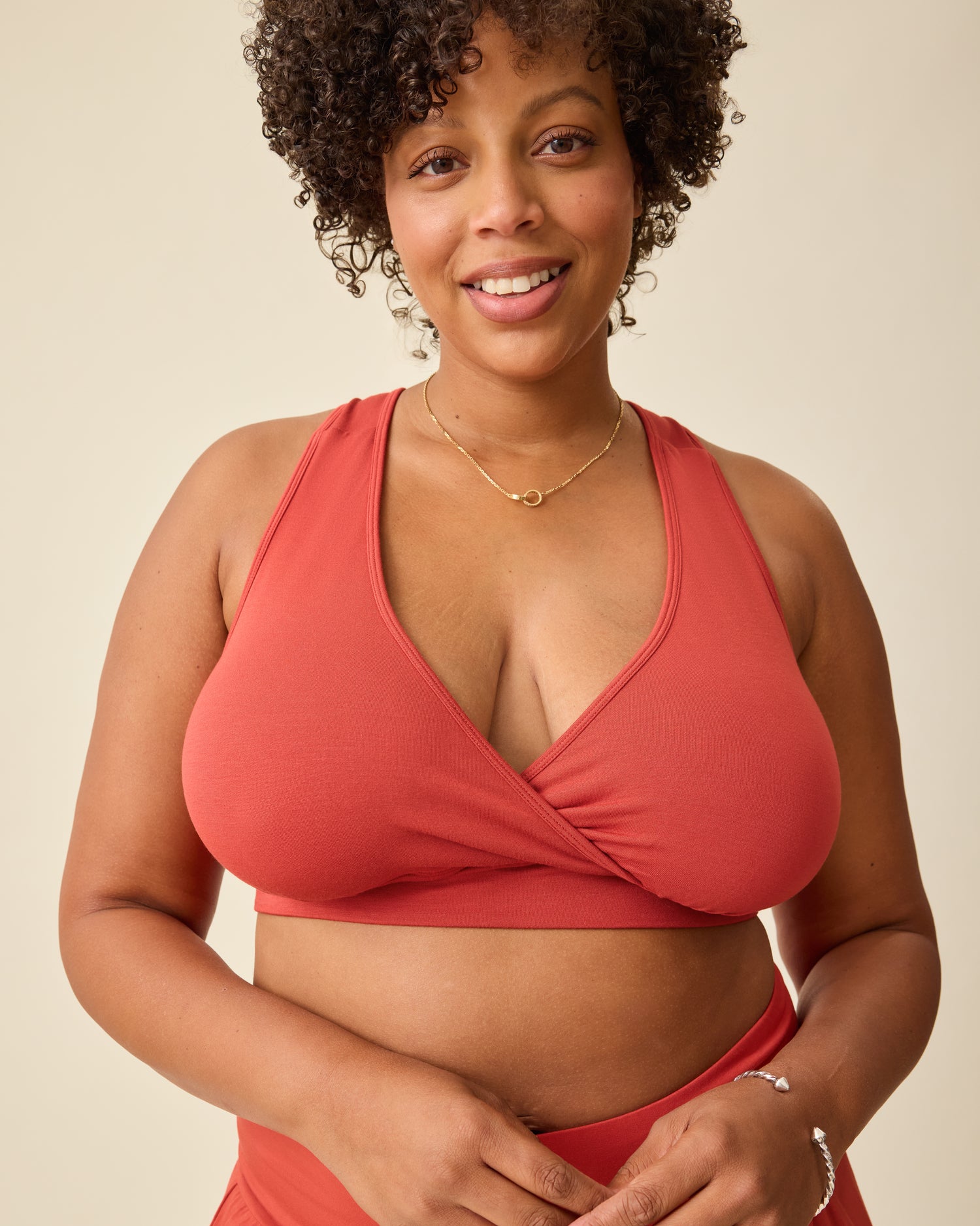 Model is wearing French Terry Racerback Nursing & Sleep Bra in Spice on a beige background @model_info:Skye is wearing a Busty XL.