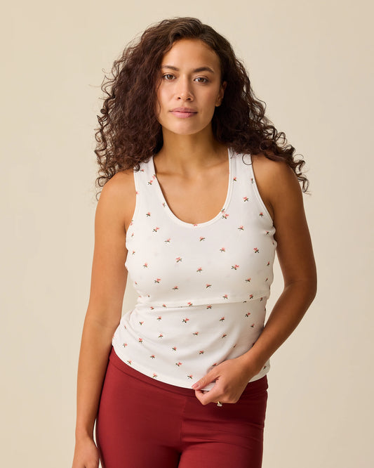 Model is wearing French Terry Racerback Tank in Ivory Wildflower on a beige background. @model_info:Sadie is wearing a Medium.
