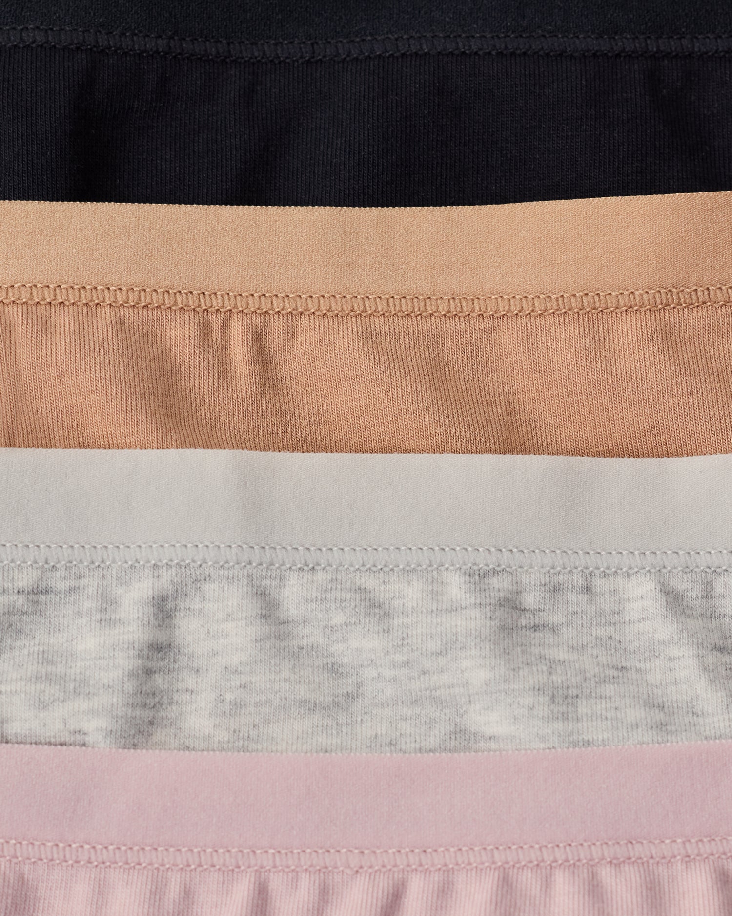 SoftStretch Undies in flat lay in four colors: Black, Buff, Grey Heather, Lilac Mist.