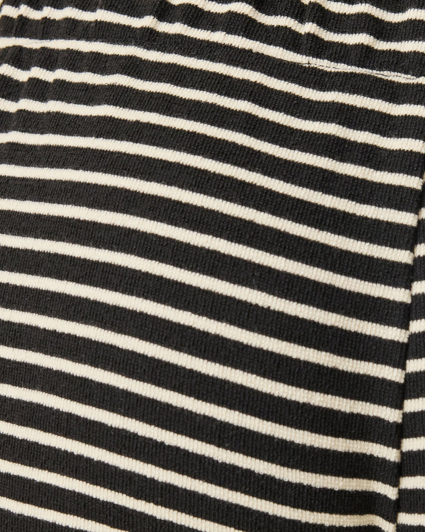 Close up of Luxe Terry Maternity & Postpartum Pant in Black & Ivory Stripe pattern.