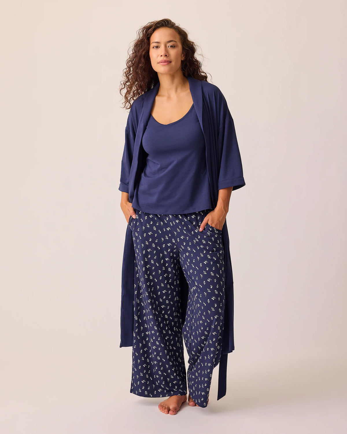 Model is wearing the Maternity & Nursing Three-Piece Pajama Set in Navy on a beige background.