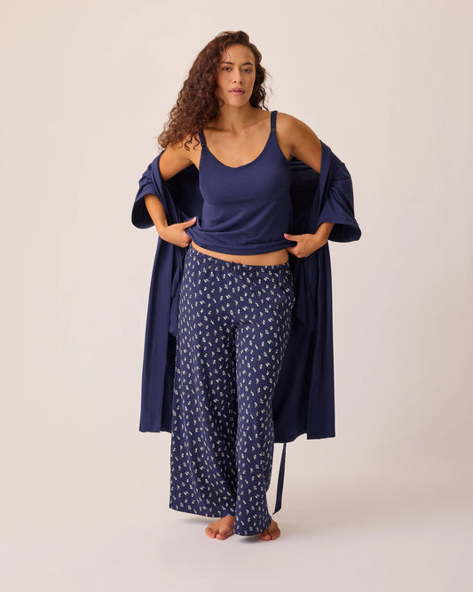 Model is wearing the Maternity & Nursing Three-Piece Pajama Set in Navy on a beige background.@model_info:Sadie is 5'8" and wearing a Medium.