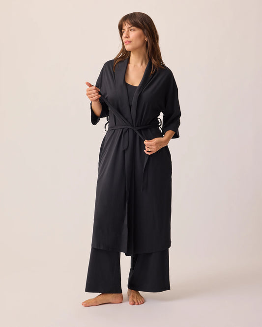 Model is wearing Robe tied shut of the Maternity & Nursing Three-Piece Pajama Set in Black, on a beige background.@model_info:KJ is 5'9" and wearing a Medium.