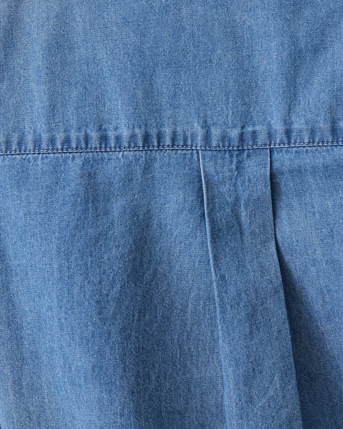Close up of  Denim Maternity & Nursing Button Up Shirt in Medium Wash.