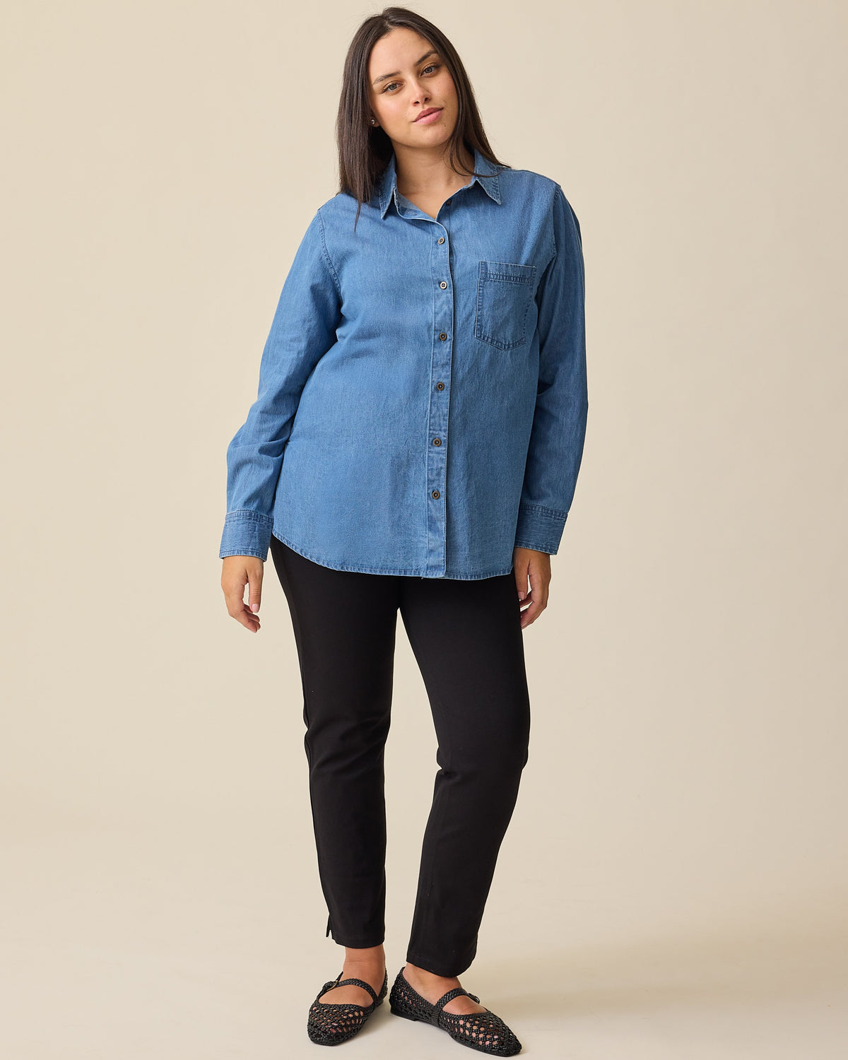 Pregnant model wearing Maternity Ponte Straight Leg Pant in Black with the Denim Maternity & Nursing Button Up Shirt