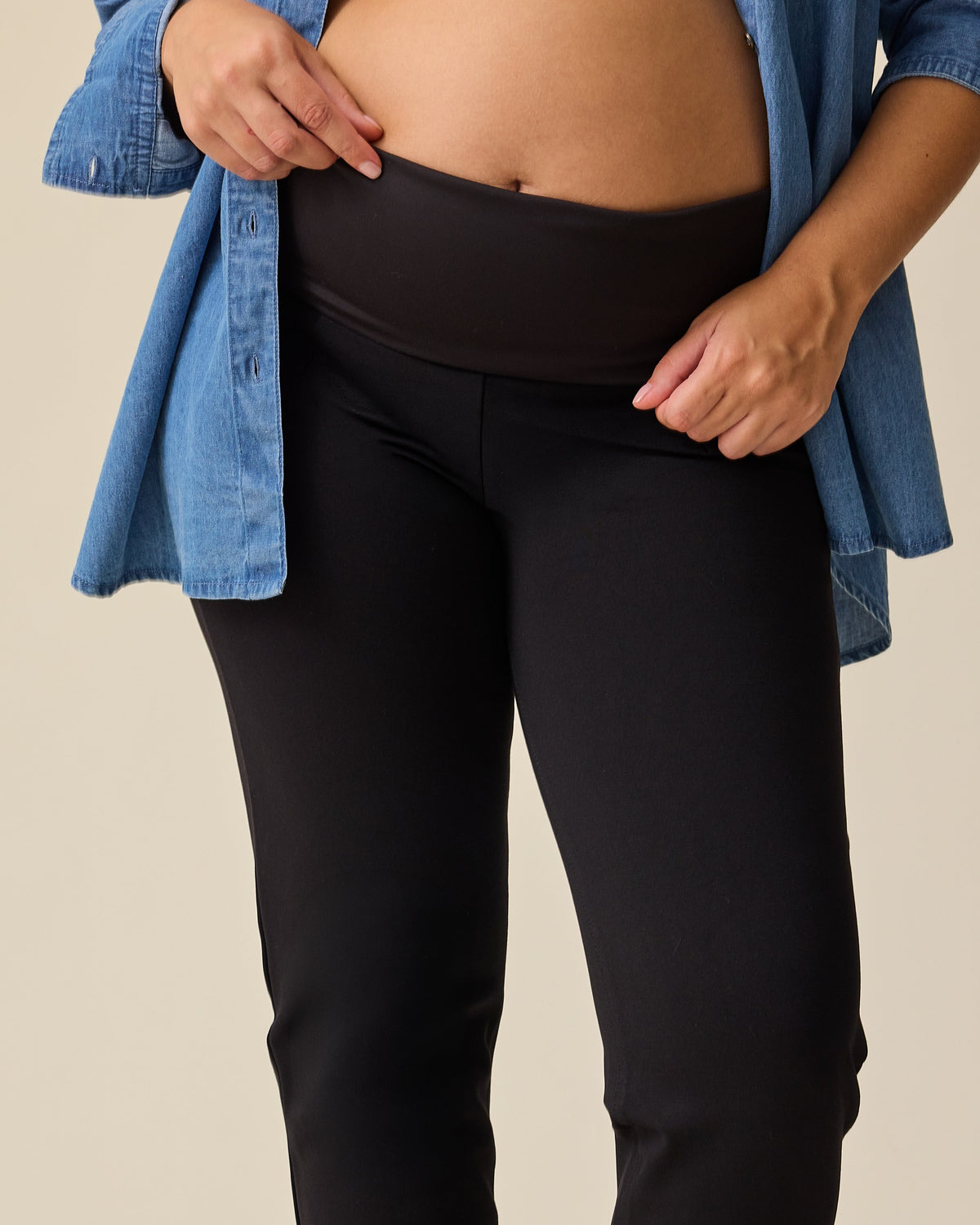 Close-up of pregnant model wearing Maternity Ponte Straight Leg Pant in Black 