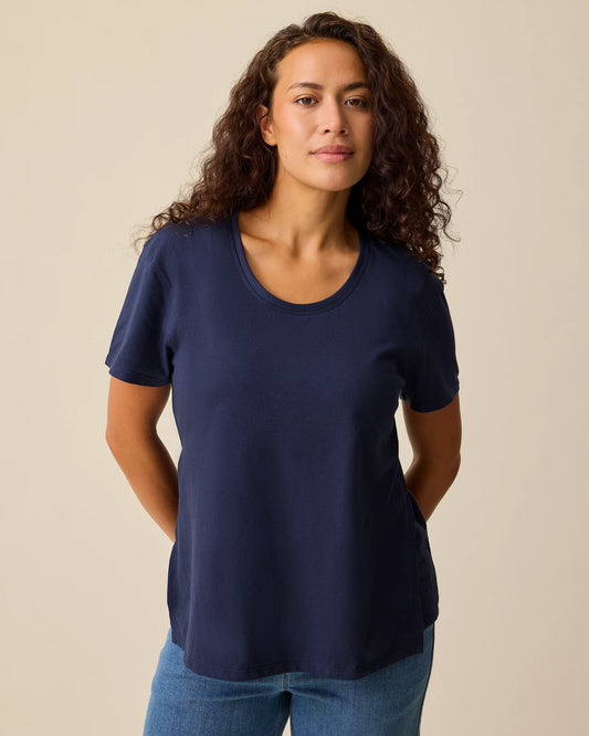 Model is wearing Relaxed Cotton Maternity & Nursing T-shirt in Navy on a beige background. @model_info:Sadie is wearing a Small.