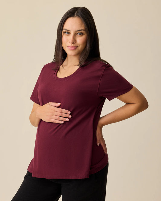 Model is wearing Relaxed Cotton Maternity & Nursing T-shirt
in Fig on a beige background. @model_info:Brianna is wearing a Medium.