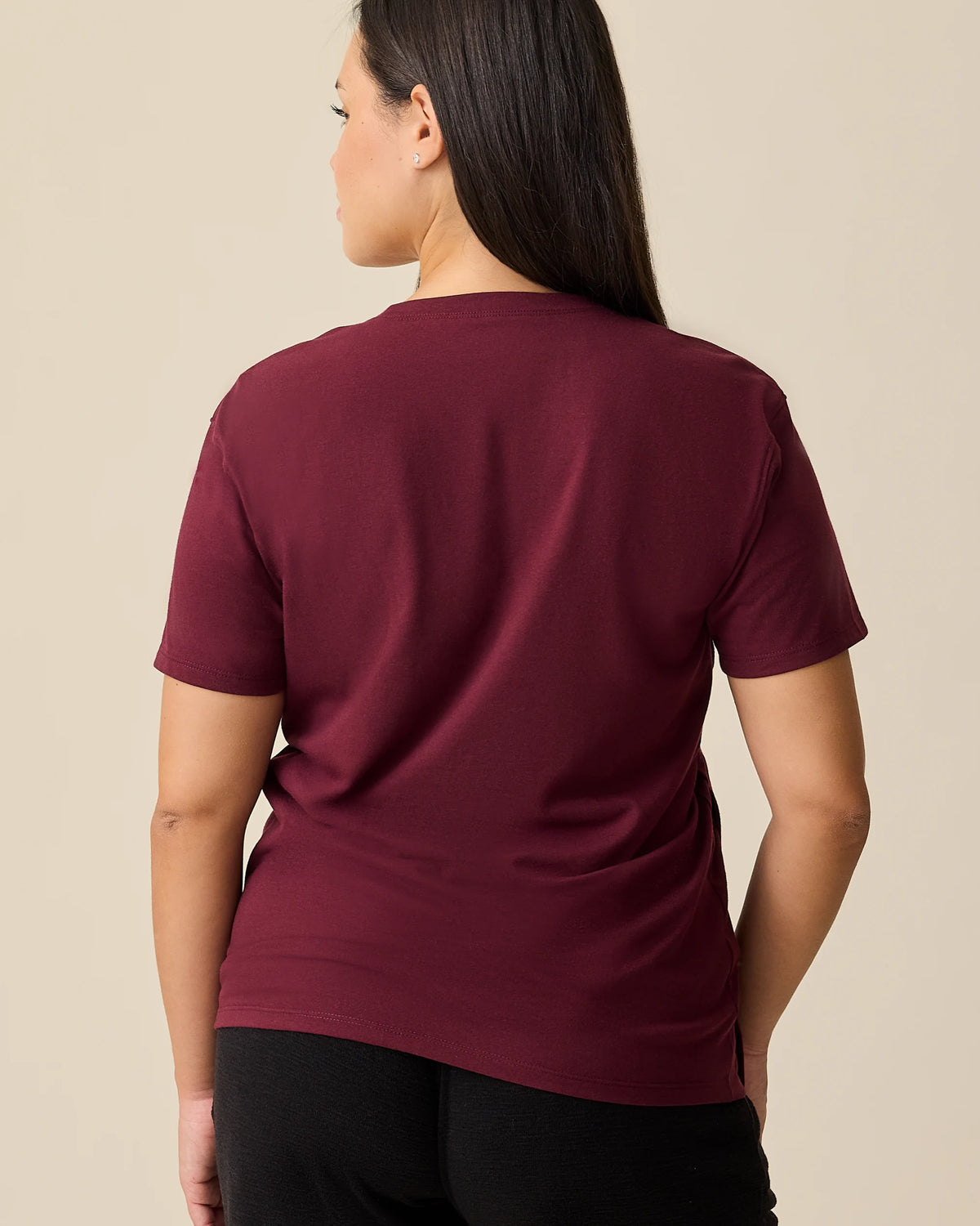 Back view of model wearing Relaxed Cotton Maternity & Nursing T-shirt
in Fig on a beige background. 