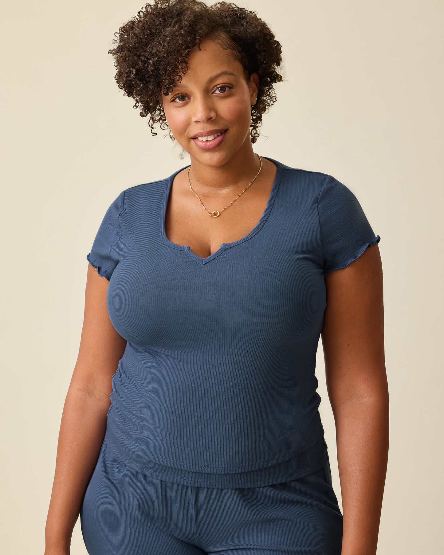 Model is wearing Ribbed Modal Notched Nursing T-shirt in Light Navy on a beige background. @model_info:Skye is wearing a Large.