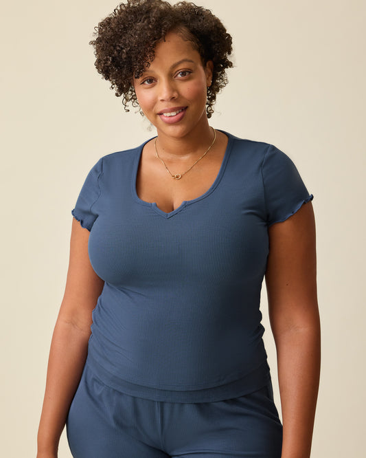 Model is wearing Ribbed Modal Notched Nursing T-shirt in Light Navy on a beige background. @model_info:Skye is wearing a Large.