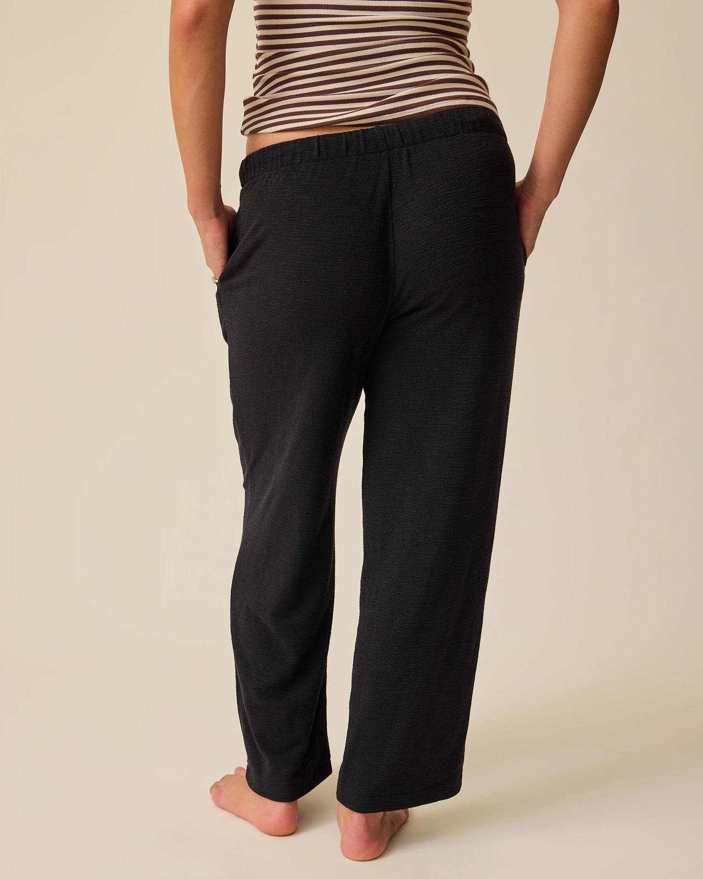 Back view of woman wearing Luxe Terry Maternity & Postpartum Pant in Black
