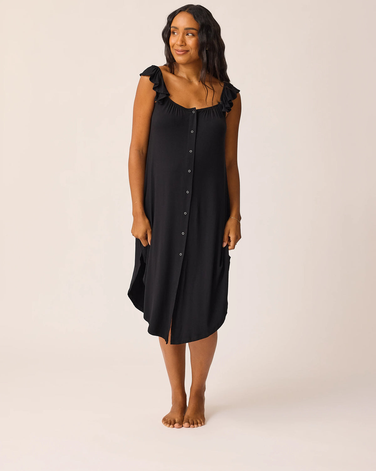 Woman wearing the Ruffle Labor & Delivery Gown in black@model_info:Aysia is 5'8" and wearing an XS/S.