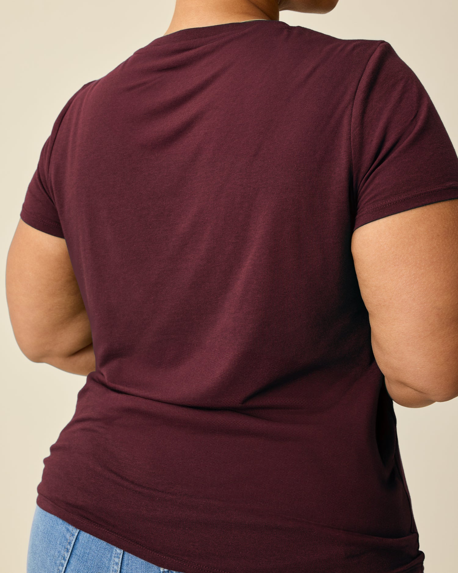 Back view of Modal Crew Neck Nursing T-shirt in Deep Burgundy on a beige background.