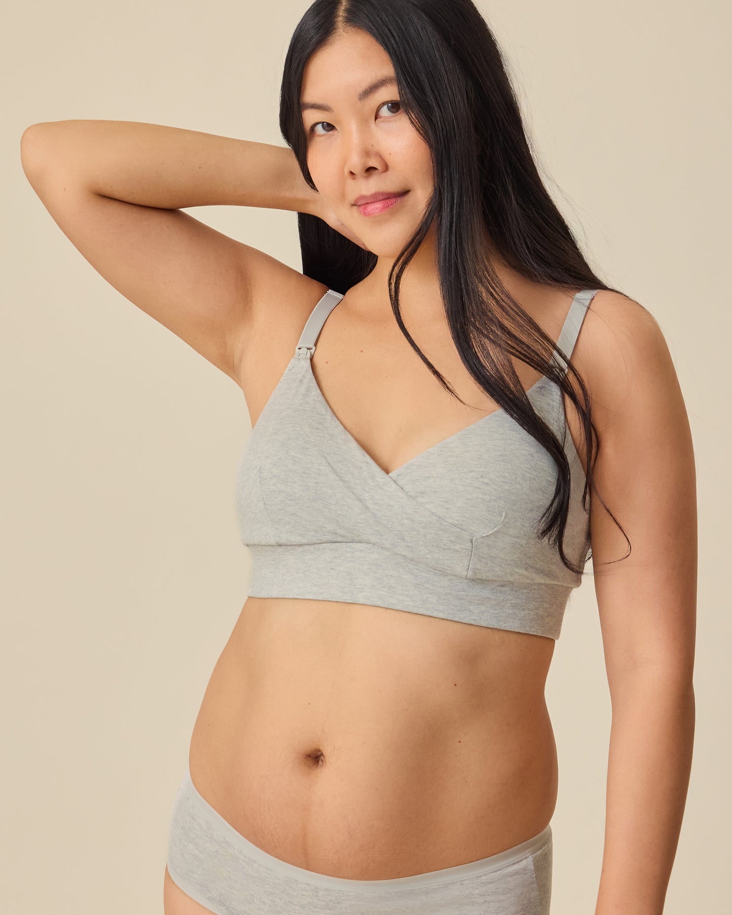 Model is wearing SoftStretch Cotton Nursing Bra and SoftStretch Cotton Maternity & Postpartum Hipster in Grey Heather on a beige background. @model_info:Theresa is wearing a Small.