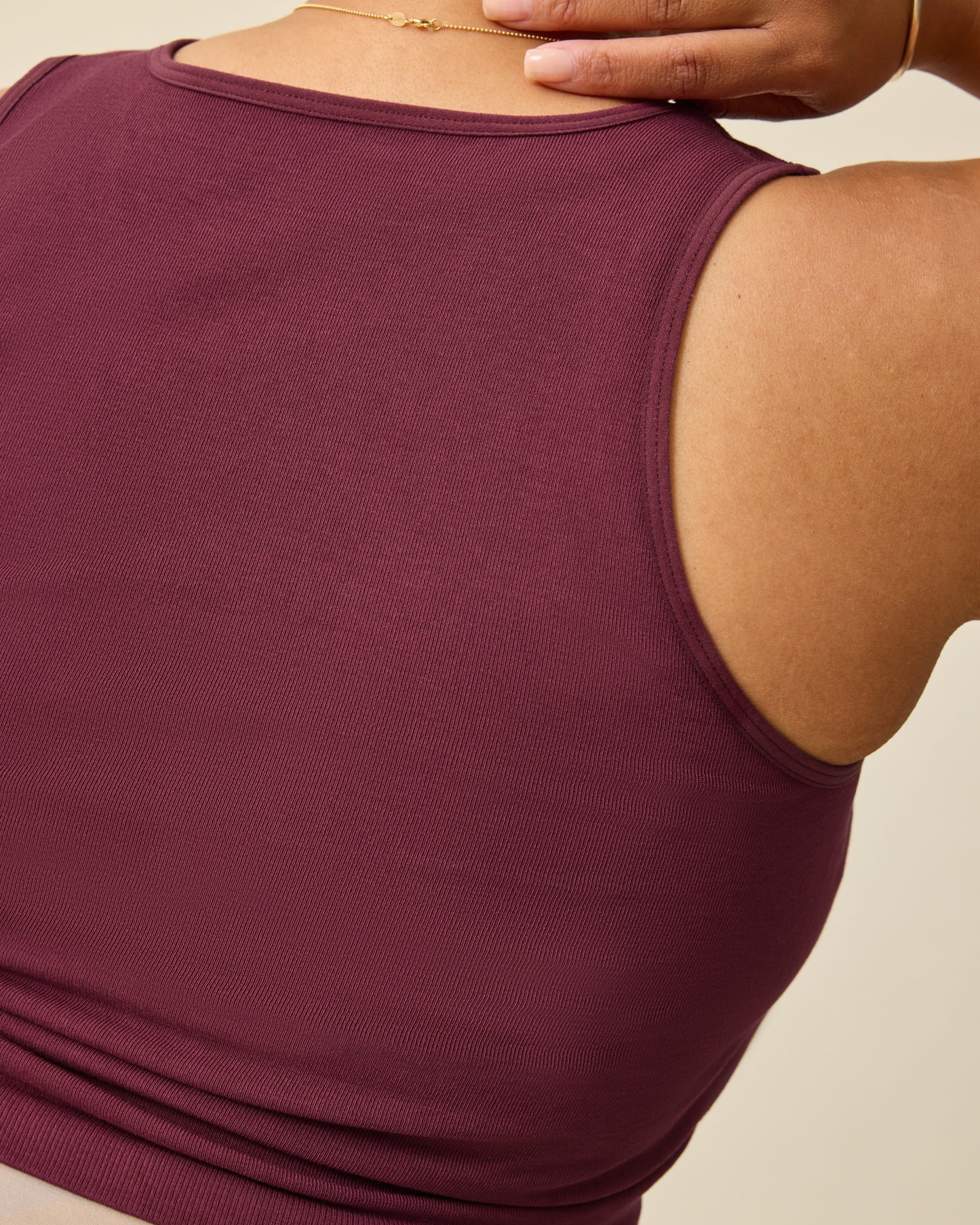 Back view of Sublime® Bamboo Maternity & Nursing Longline Bra Top in Deep Burgundy on a beige background.