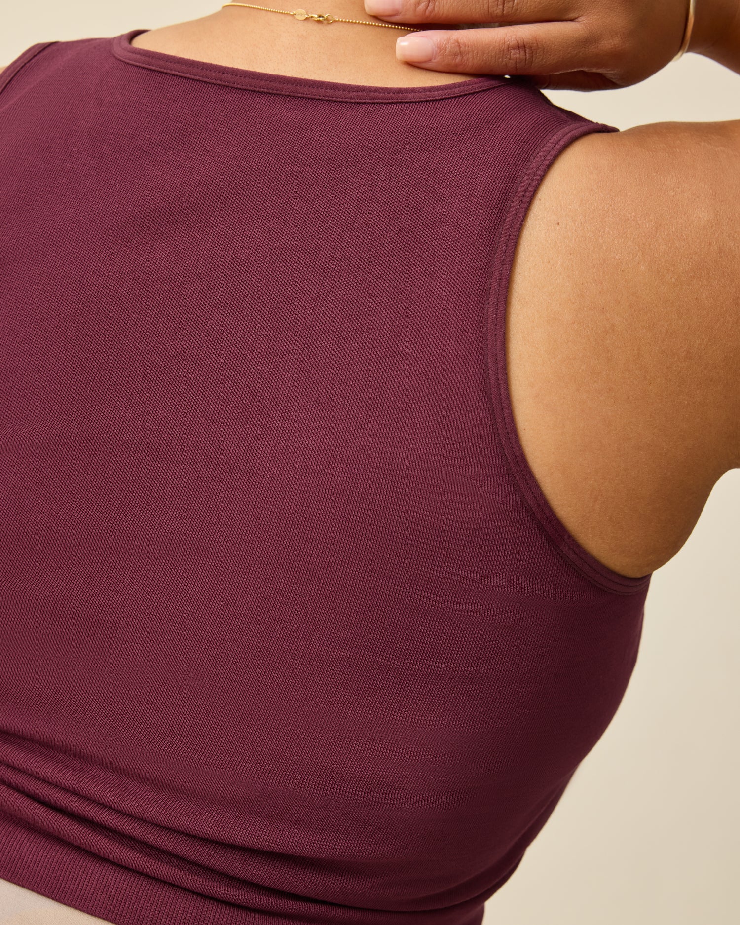 Back view of Sublime® Bamboo Maternity & Nursing Longline Bra Top in Deep Burgundy on a beige background.