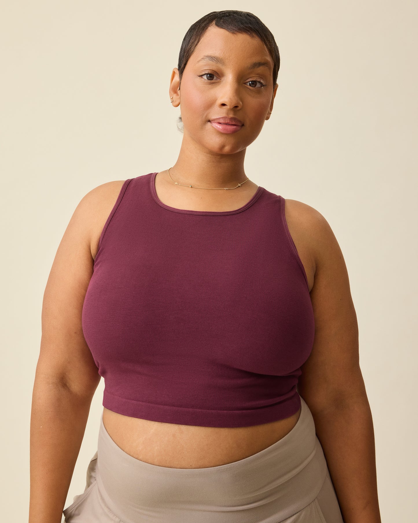 Model is wearing Sublime® Bamboo Maternity & Nursing Longline Bra Top in Deep Burgundy on a beige background. @model_info:Brittany is wearing an X-Large.