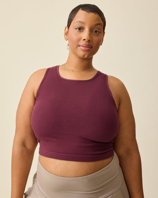 Model is wearing Sublime® Bamboo Maternity & Nursing Longline Bra Top in Deep Burgundy on a beige background. @model_info:Brittany is wearing an X-Large.