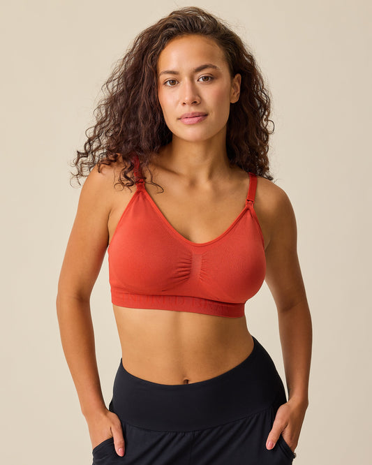 Model is wearing Simply Sublime® Nursing Bra in Spice on a beige background. @model_info:Sadie is wearing a Medium.