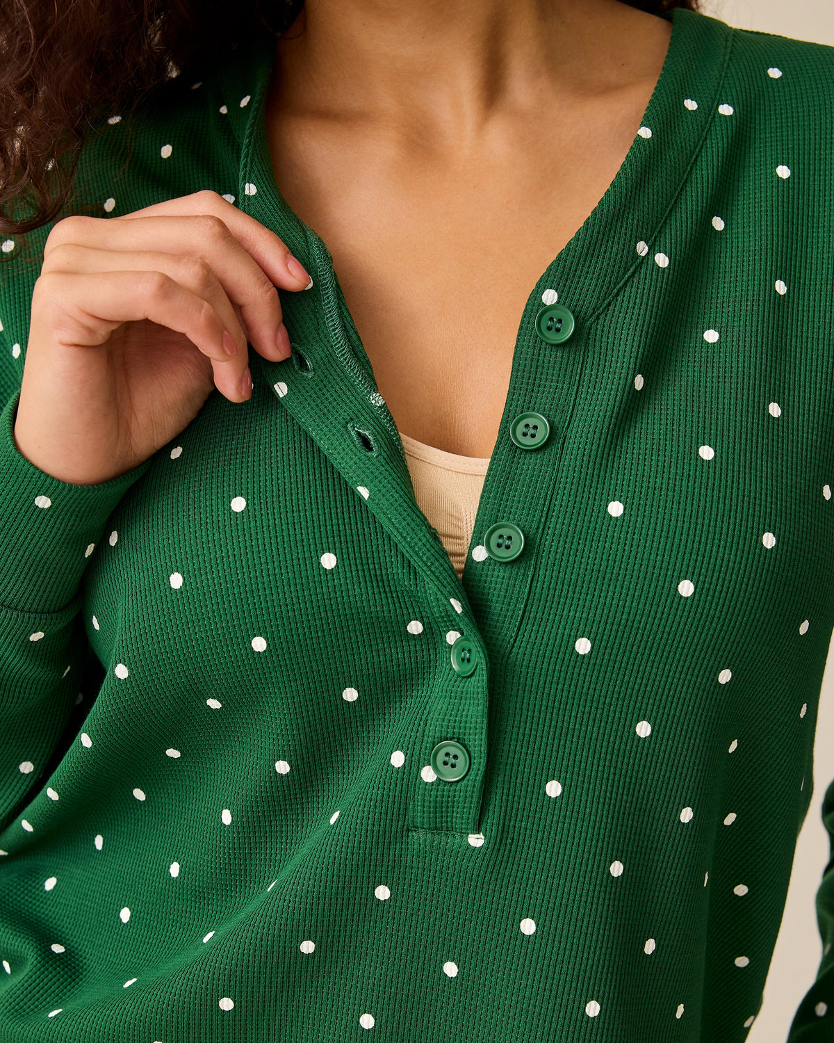 Close up of collar on Waffle Maternity & Nursing Lounge Set in Green Dot on a beige background.