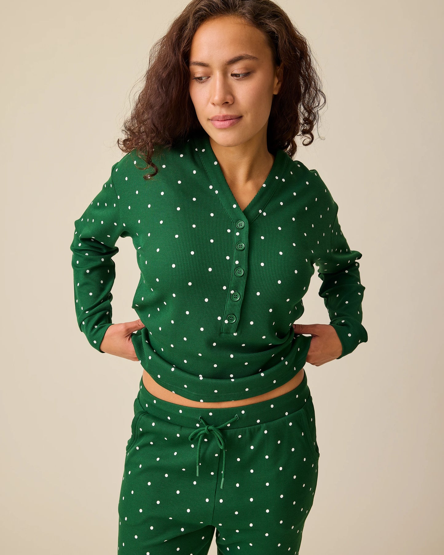 Model is wearing Waffle Maternity & Nursing Lounge Set in Green Dot on a beige background.