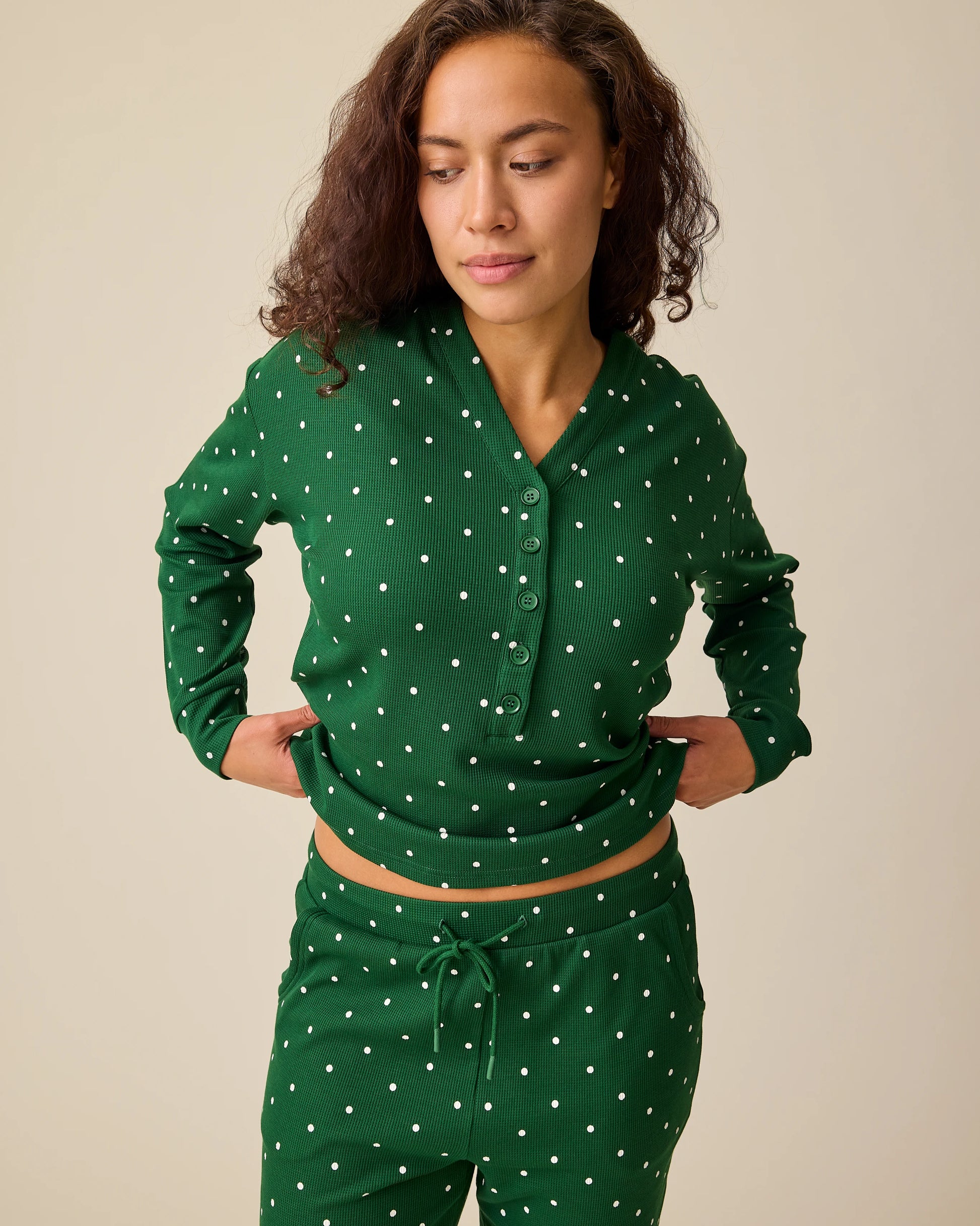 Model is wearing Waffle Maternity & Nursing Lounge Set in Green Dot on a beige background.