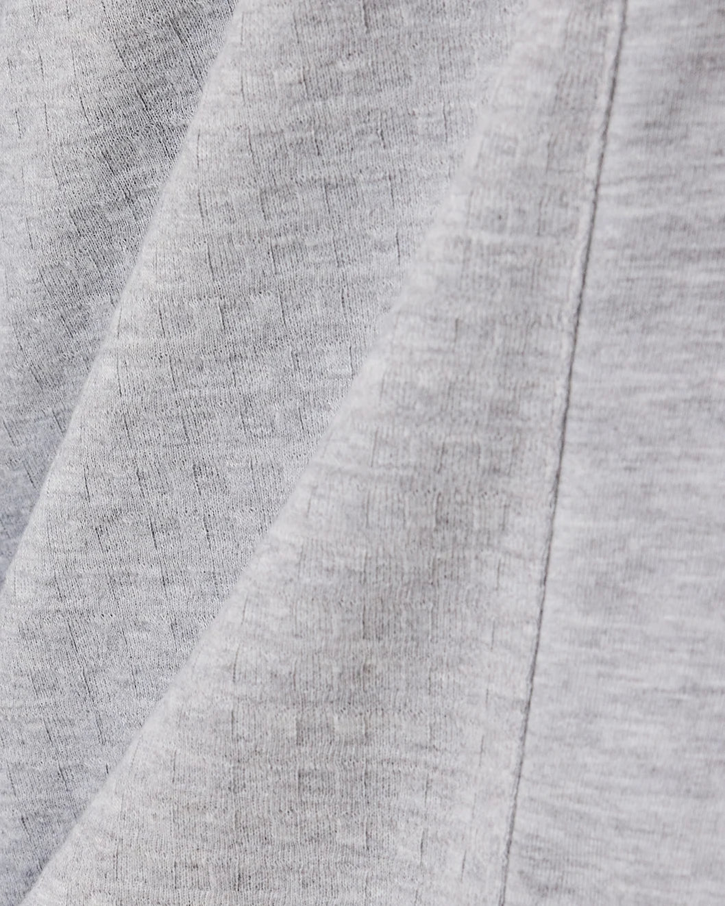 Close up of the textured material on the Waffle Maternity & Nursing Three-Piece Lounge Set in Grey Heather.